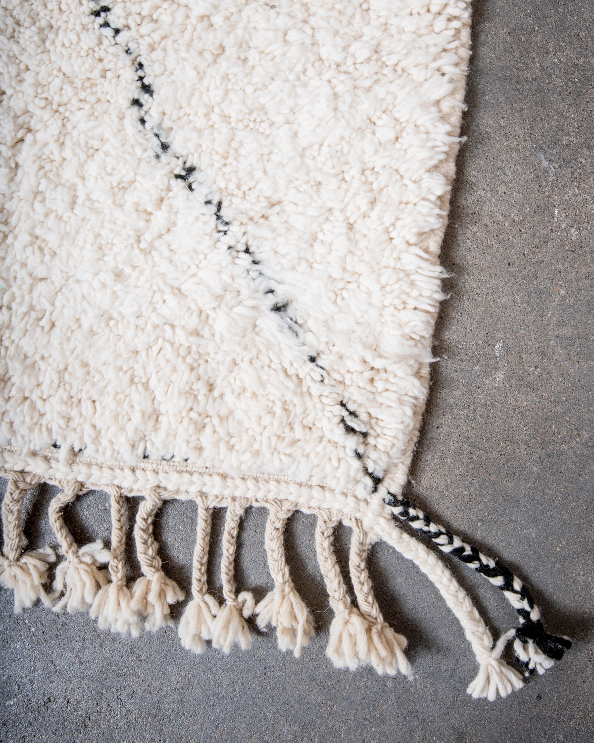 Modern, designer, handcrafted Berber rug from Morocco. Beniourain carpet with minimalist design, natural wool pile and a fluffy texture.